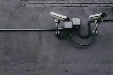 A video protection camera is installed against a wall